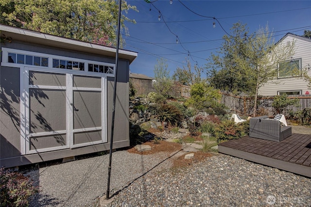 view of shed with fence