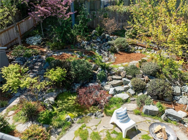 drone / aerial view with a garden pond