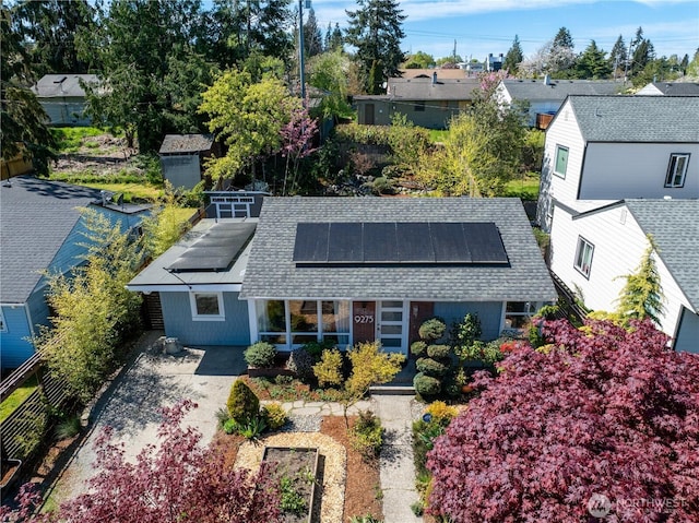 birds eye view of property with a residential view