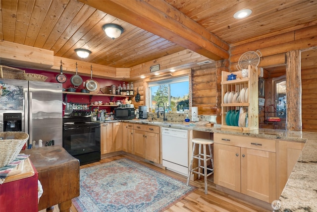 kitchen featuring log walls, wooden ceiling, and black appliances