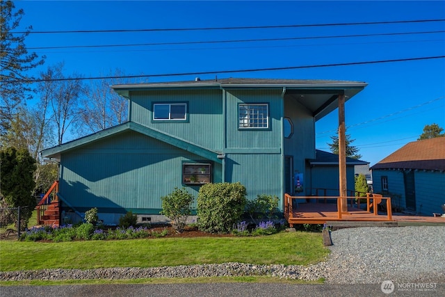 5201 Hyada Blvd NE, Tacoma, WA 98422 - view of front of house featuring a wooden deck and a front yard