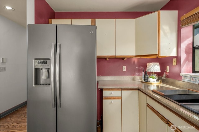 5201 Hyada Blvd NE, Tacoma, WA 98422 - kitchen with stainless steel fridge, recessed lighting, wood finished floors, light countertops, and cream cabinets
