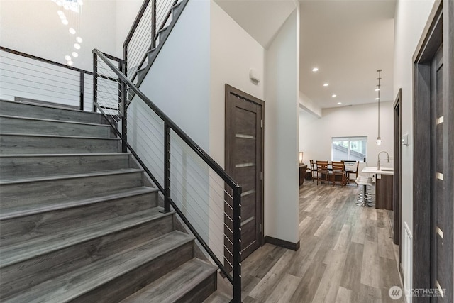 43 Rocky Ridge Dr, Bellingham, WA 98229 - stairway featuring recessed lighting, wood finished floors, and baseboards