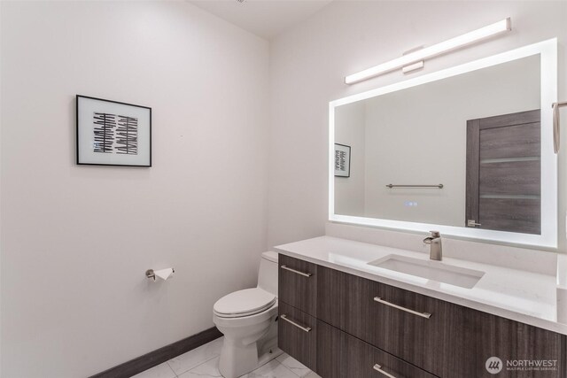 43 Rocky Ridge Dr, Bellingham, WA 98229 - bathroom featuring baseboards, marble finish floor, vanity, and toilet