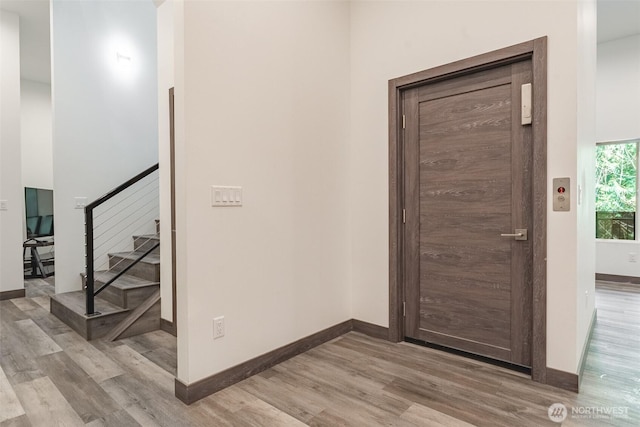43 Rocky Ridge Dr, Bellingham, WA 98229 - entryway featuring baseboards, wood finished floors, and stairway