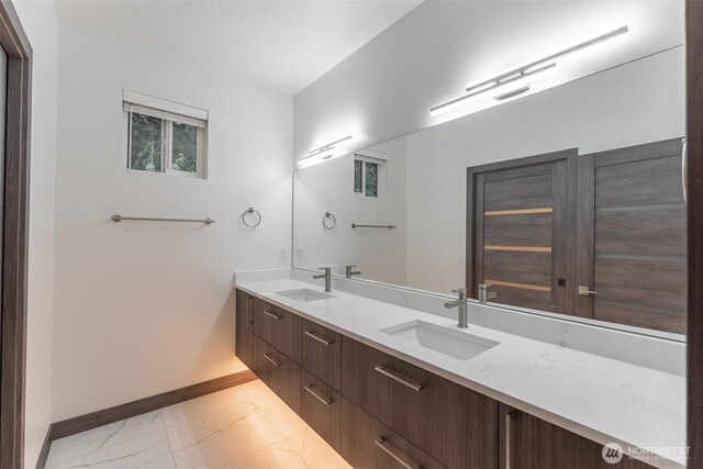 43 Rocky Ridge Dr, Bellingham, WA 98229 - bathroom featuring baseboards, marble finish floor, a sink, and double vanity