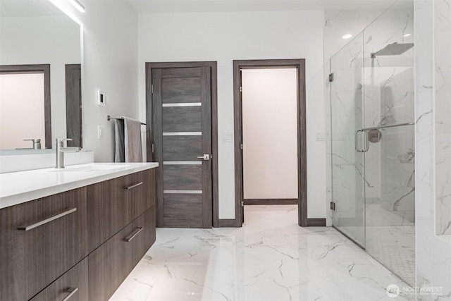 43 Rocky Ridge Dr, Bellingham, WA 98229 - bathroom featuring marble finish floor, baseboards, vanity, and a marble finish shower