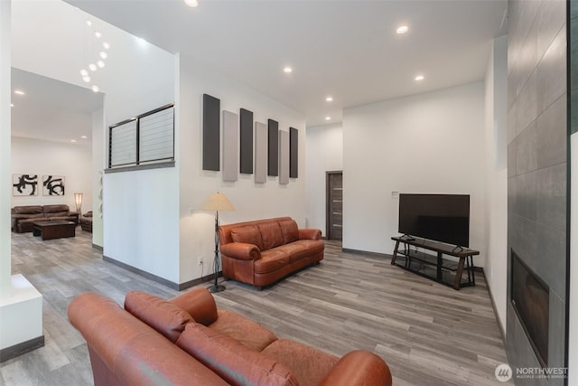 43 Rocky Ridge Dr, Bellingham, WA 98229 - living room featuring a fireplace, baseboards, wood finished floors, and recessed lighting