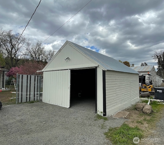 view of outdoor structure featuring an outdoor structure and fence