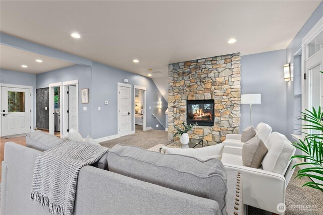 living area featuring a fireplace, recessed lighting, baseboards, and carpet flooring