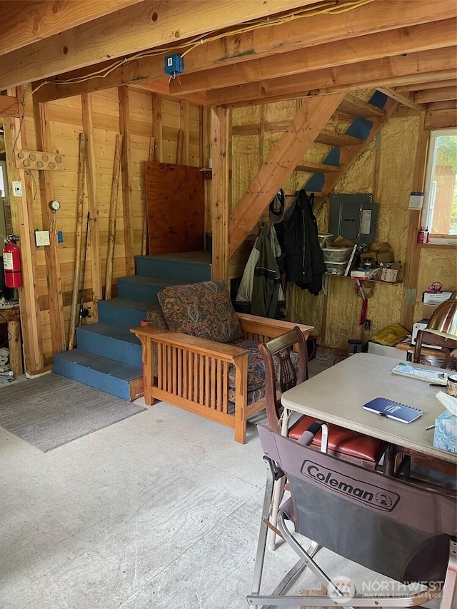 interior space featuring electric panel and stairs