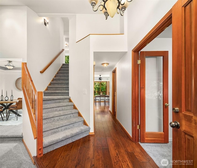 26032 5th Ave NE, Arlington, WA 98223 - foyer with stairway, dark wood-style flooring, and a chandelier