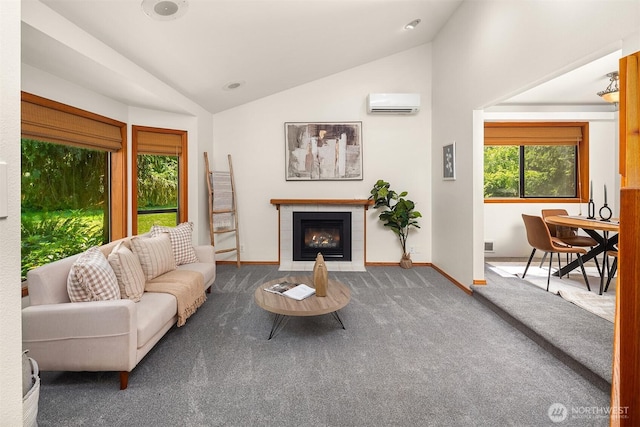 26032 5th Ave NE, Arlington, WA 98223 - living area with a wall unit AC, carpet flooring, lofted ceiling, and a tiled fireplace