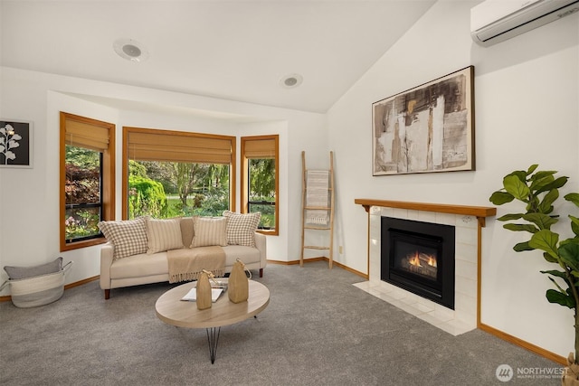 26032 5th Ave NE, Arlington, WA 98223 - living room featuring a wall mounted AC, carpet flooring, a fireplace, and vaulted ceiling