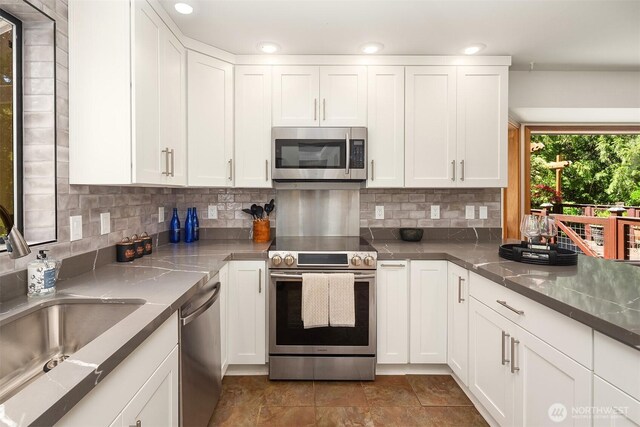 26032 5th Ave NE, Arlington, WA 98223 - kitchen with stainless steel appliances and white cabinets