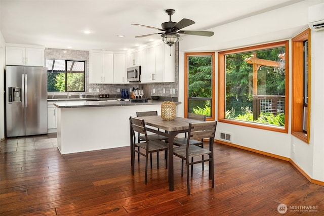 26032 5th Ave NE, Arlington, WA 98223 - dining room featuring dark wood-style floors, a ceiling fan, an AC wall unit, and recessed lighting