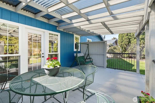 view of patio featuring a pergola and outdoor dining area