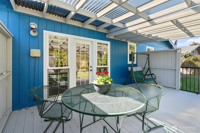 deck with outdoor dining area