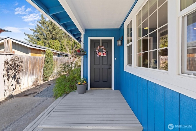 doorway to property with fence