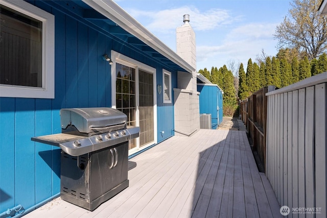 deck featuring a grill and fence