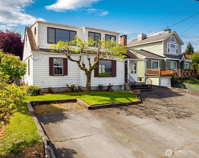 5323 Hyada Blvd NE, Tacoma, WA 98422 - view of front of house featuring central air condition unit, concrete driveway, and a front yard