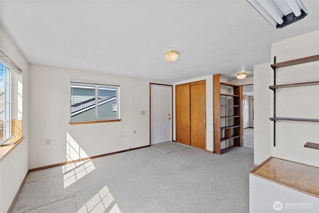 5323 Hyada Blvd NE, Tacoma, WA 98422 - interior space with carpet floors, baseboards, and a wealth of natural light