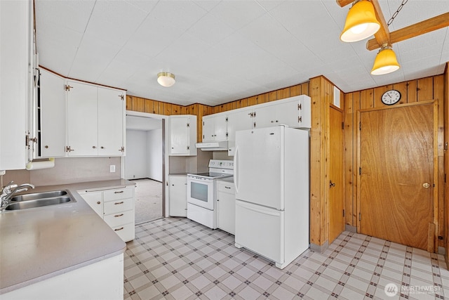 5323 Hyada Blvd NE, Tacoma, WA 98422 - kitchen featuring a sink, light floors, wooden walls, and white appliances