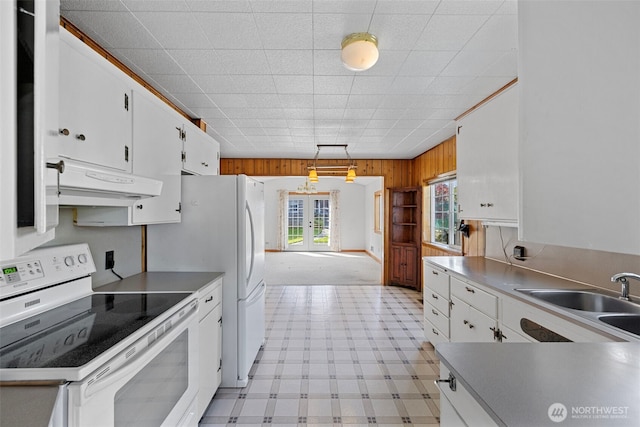 5323 Hyada Blvd NE, Tacoma, WA 98422 - kitchen featuring electric range, a sink, white cabinets, light floors, and under cabinet range hood