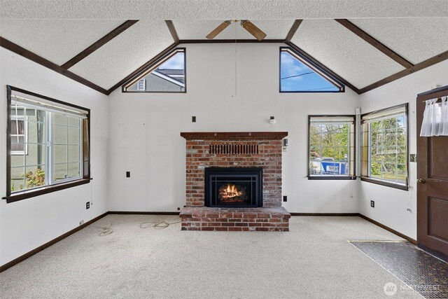 5323 Hyada Blvd NE, Tacoma, WA 98422 - unfurnished living room featuring a fireplace, plenty of natural light, and carpet