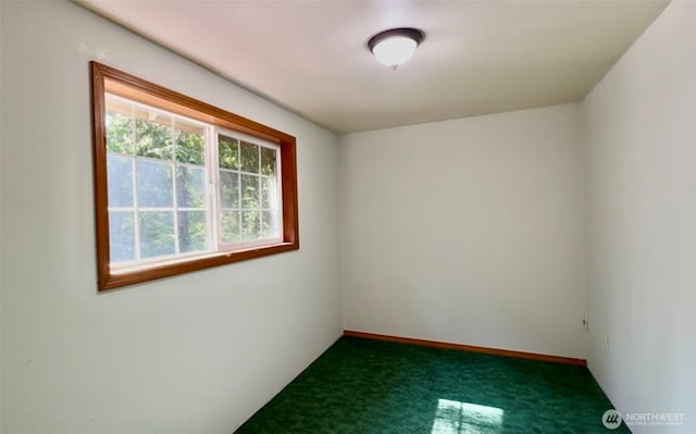 500 N Duckabush Dr W, Hoodsport, WA 98548 - unfurnished room featuring dark colored carpet and baseboards