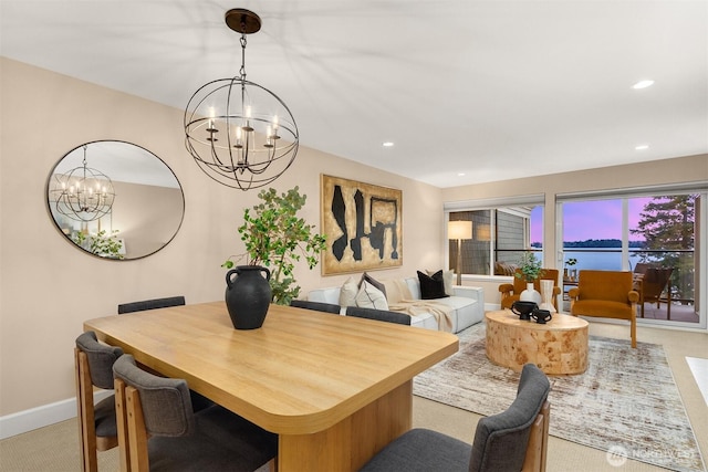 dining space with recessed lighting, carpet, baseboards, and a notable chandelier