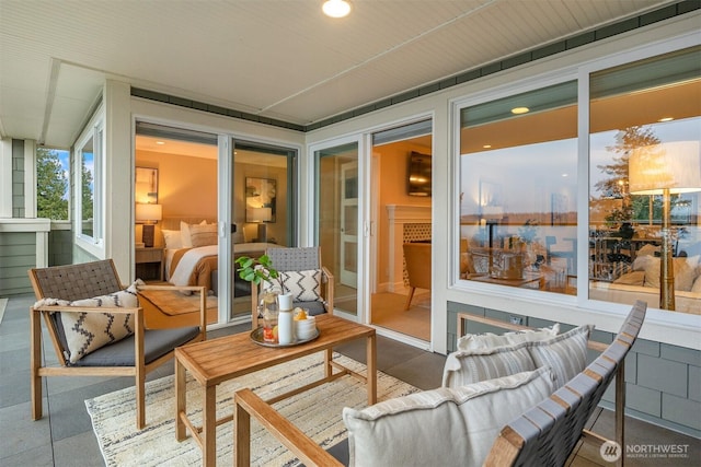 sunroom / solarium with an outdoor hangout area and recessed lighting