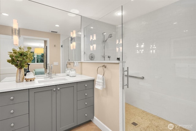 ensuite bathroom featuring a stall shower, ensuite bathroom, visible vents, recessed lighting, and vanity