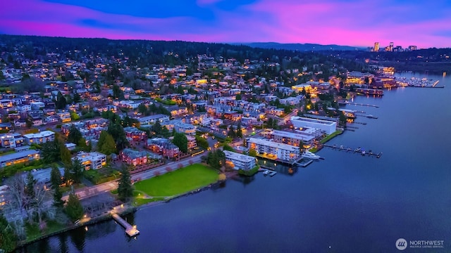 aerial view at dusk with a water view