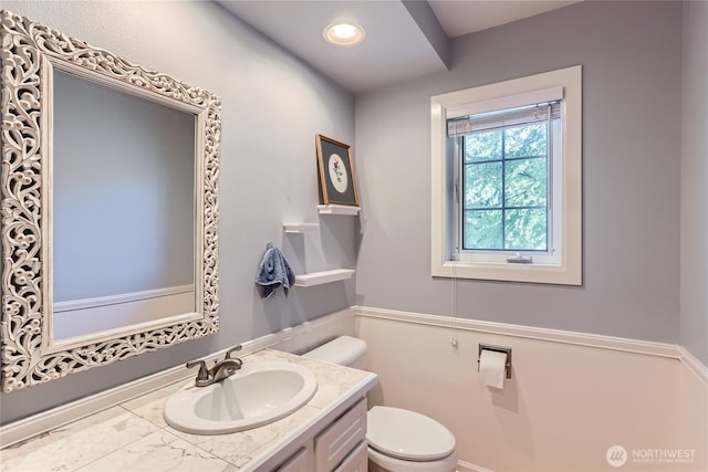 bathroom with vanity and toilet