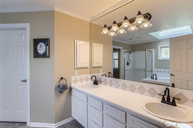 full bath featuring a skylight, a sink, tasteful backsplash, and a stall shower