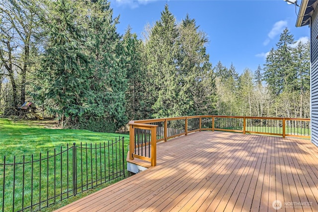 wooden terrace with a lawn