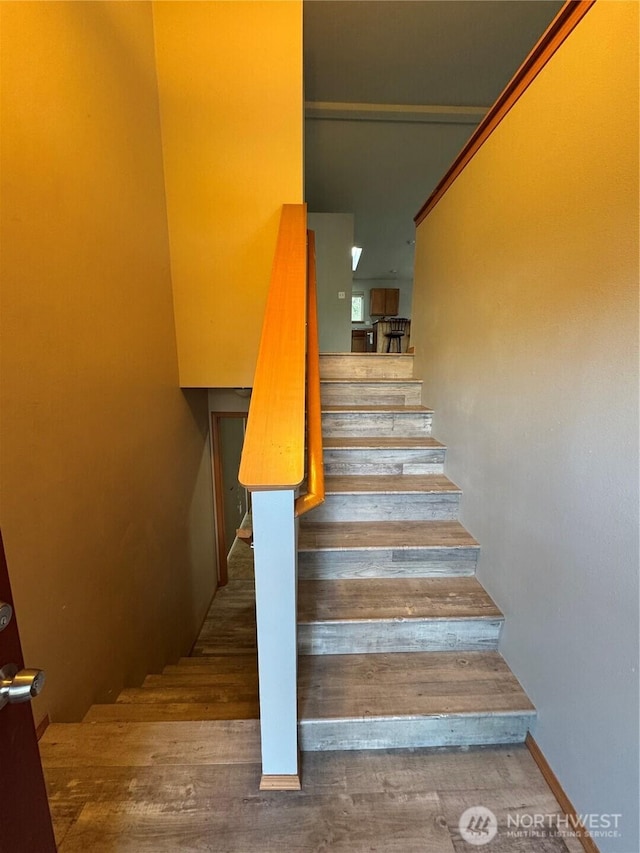 stairway with wood finished floors