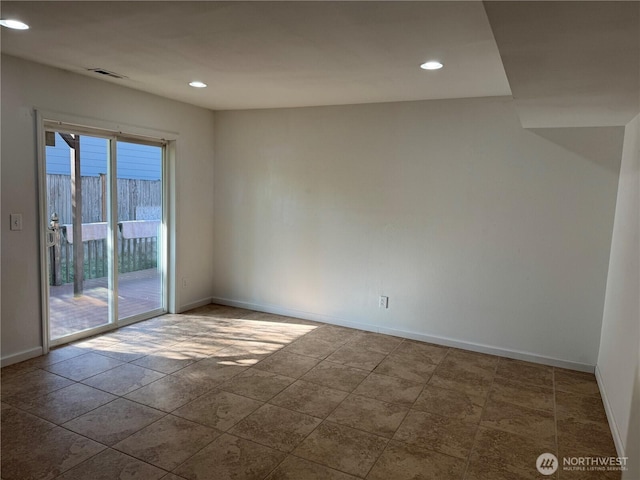 empty room featuring visible vents, recessed lighting, and baseboards