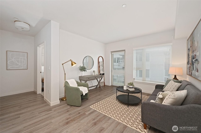 1760 NW 56th St Unit 601, Seattle, WA 98107 - living room featuring wood finished floors and baseboards