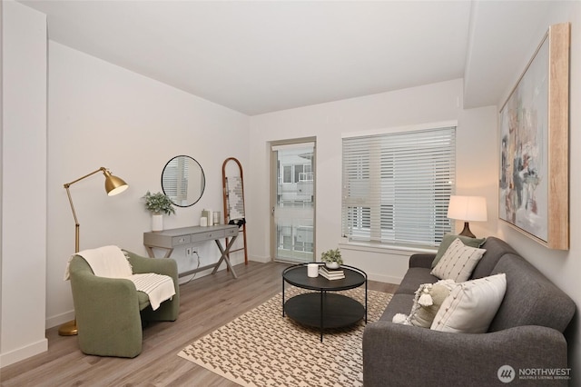 1760 NW 56th St Unit 601, Seattle, WA 98107 - living area featuring baseboards and wood finished floors