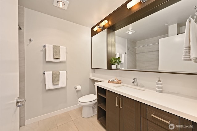 1760 NW 56th St Unit 601, Seattle, WA 98107 - bathroom with tile patterned floors, tiled shower, toilet, baseboards, and vanity