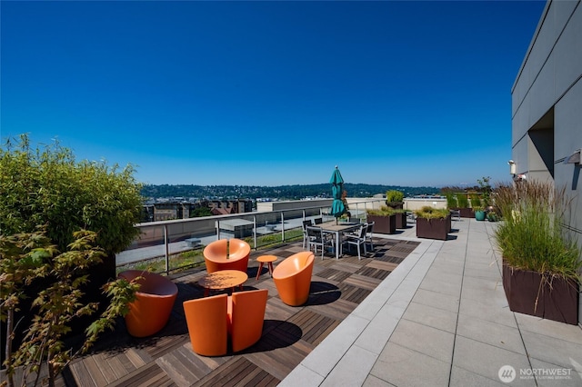 1760 NW 56th St Unit 601, Seattle, WA 98107 - view of patio / terrace featuring outdoor dining area and a balcony