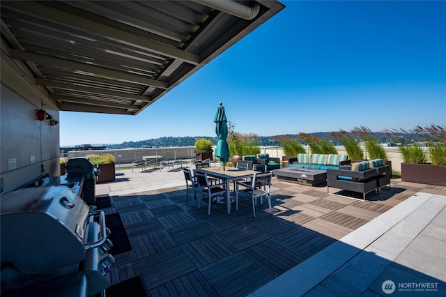 1760 NW 56th St Unit 601, Seattle, WA 98107 - view of patio featuring grilling area, an outdoor living space with a fire pit, and outdoor dining space