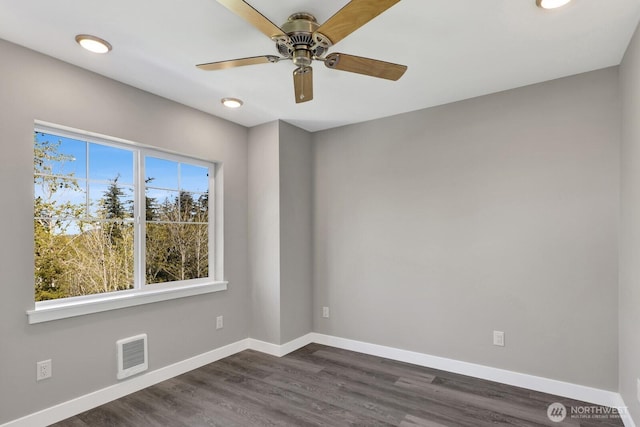 unfurnished room featuring a ceiling fan, visible vents, baseboards, dark wood-style floors, and recessed lighting
