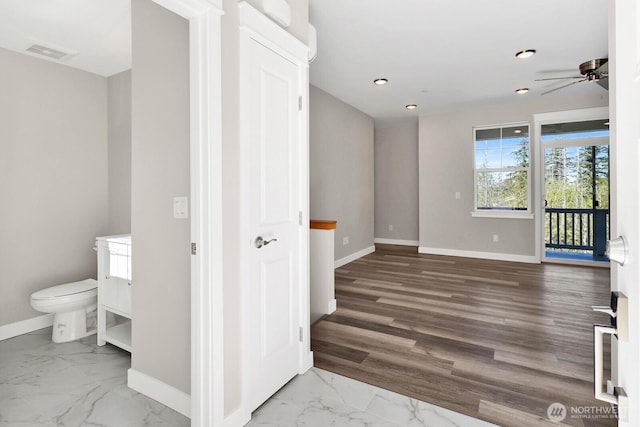3513 Sussex Dr, Bellingham, WA 98226 - hallway featuring baseboards, marble finish floor, and visible vents