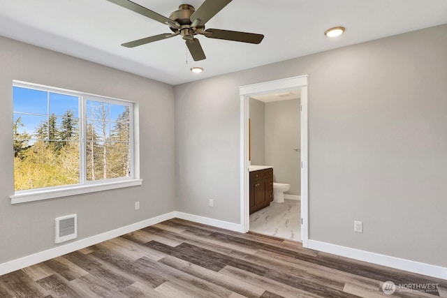 3513 Sussex Dr, Bellingham, WA 98226 - unfurnished bedroom with recessed lighting, baseboards, ensuite bathroom, visible vents, and wood finished floors