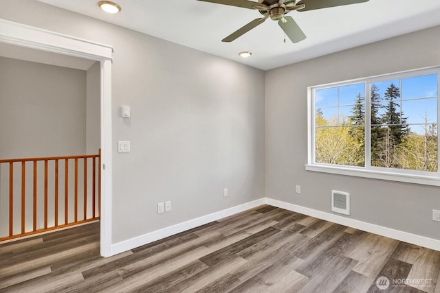3513 Sussex Dr, Bellingham, WA 98226 - unfurnished room featuring a ceiling fan, baseboards, visible vents, and wood finished floors
