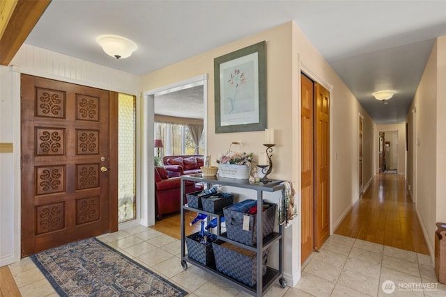 entryway featuring light tile patterned floors