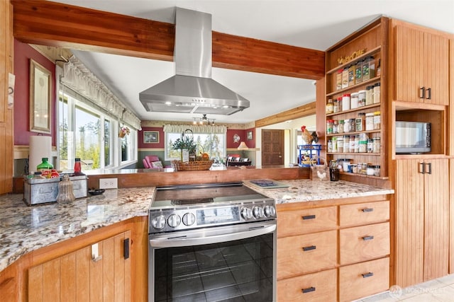 kitchen with wall chimney range hood, stainless steel electric stove, light stone counters, and open shelves